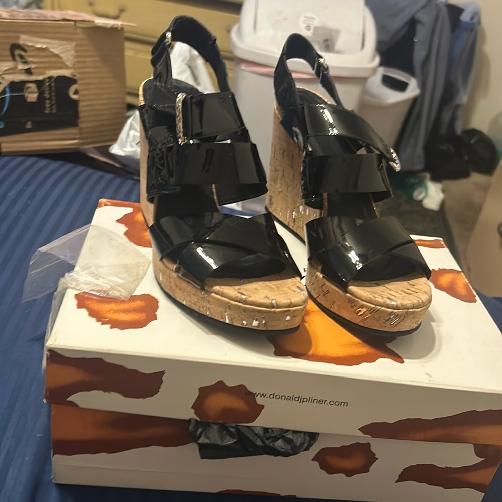 Donald Pliner platform sandals in patent leather and cork heal.